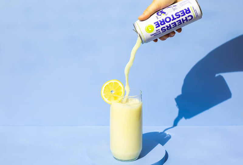 Pouring cheers restore can into a glass