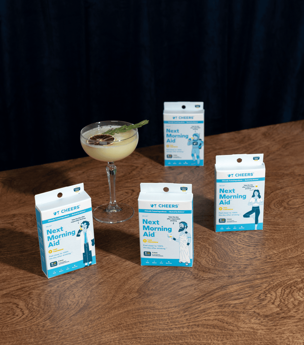 boxes of cheers relief on a table with a cocktail