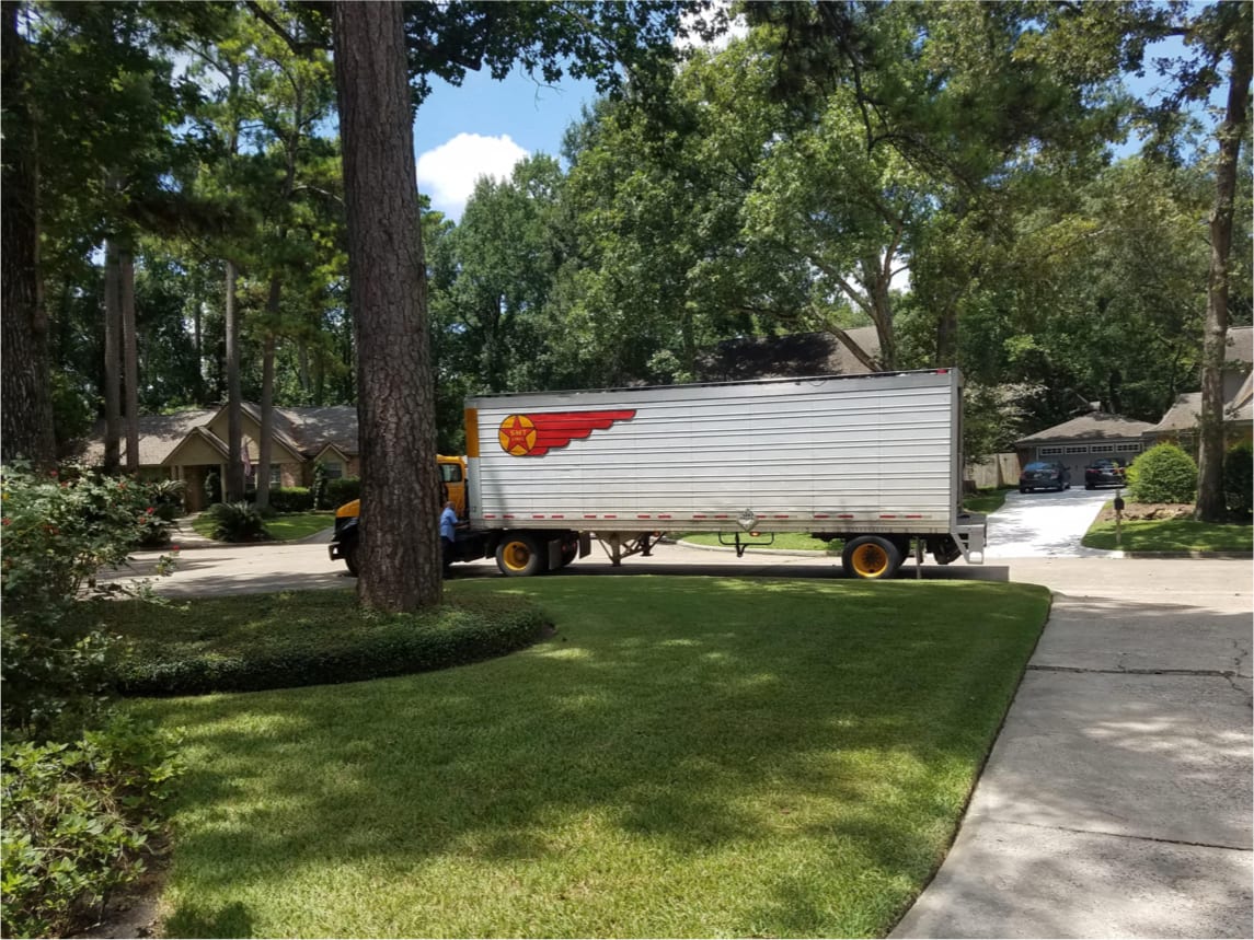 Semi-truck parked outside a neighborhood home