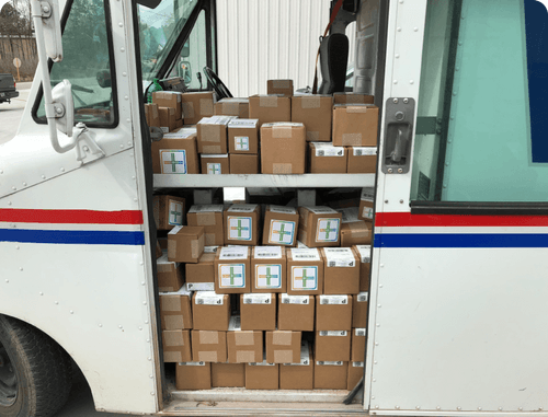 Postal truck with boxes stacked inside
